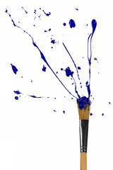 Blue paint bursting out of paintbrush
