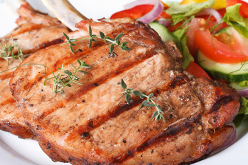 Grilled pork macro and salad with fresh vegetables