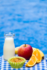 Healthy snack with muffin, fruit and fresh milk