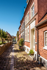 Fototapeta na wymiar Oldfashioned street architecture with apartments