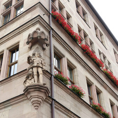 Beautiful old building with stone knight