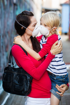 Woman and son wearing face masks