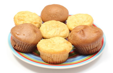 Fresh baked apple and coffee muffins on colorful plate