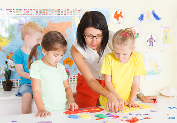 Pre-schoolers in the classroom with a teacher