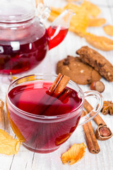 Fruit tea with cookies on wooden background