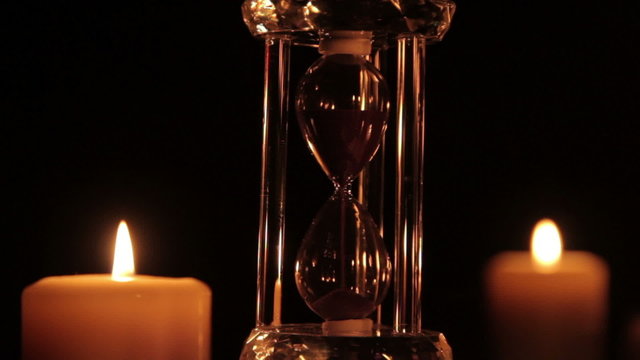 Hourglass and candle