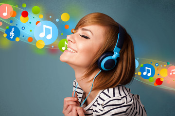 Young woman listening to music with headphones