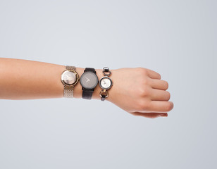 Hand with watch showing precise time