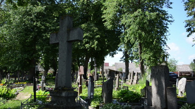 Women visit close people in cemetery