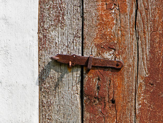 iron latch on a wooden door