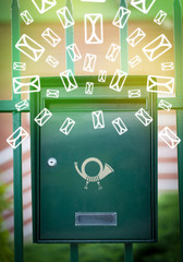 Mailbox with letter icons on glowing green background