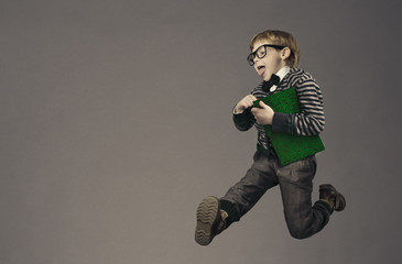 child running back to school, funny kid portrait, jumping smart