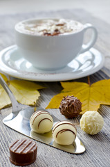 Pralines and a cup of cappuccino