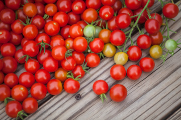 Cherry tomatoes  on a  wooden background