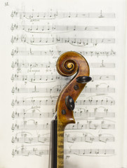 beautiful violin on a sheet music background