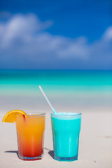 Blue Curacao and Mango cocktail on the white sandy beach