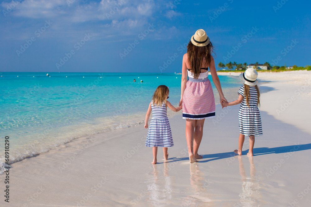 Sticker Back view of mother and little daughters enjoy summer vacation