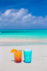 Two tasty cocktails on the white sandy beach