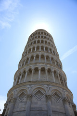 Fototapeta na wymiar Leaning tower of pisa with sun rays halo