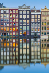 Fototapeta premium The Damrak canal in Amsterdam, Netherlands.