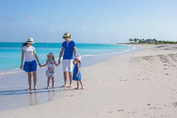 Happy family with two girls on summer vacation