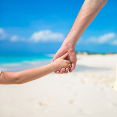 Close-up of male and kid's hands