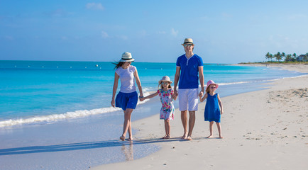 Family of four on beach vacation