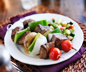 steak and vegetable shishkabob skewers with cucumber salad
