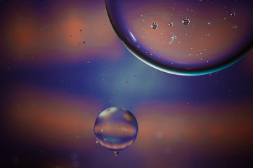 bubbles over water surface at colorful background