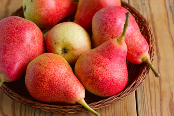 Ripe red pears on the wooden table