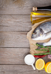 Fresh dorado fish cooking with spices and condiments