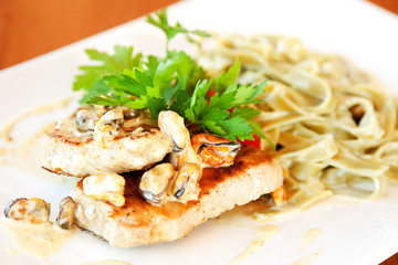 Fettuccine with mussels and grilled salmon