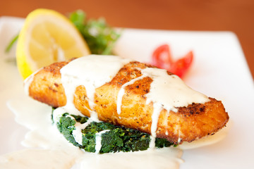 Grilled salmon fillet with spinach