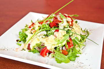 Mix salad with prawns and strawberry