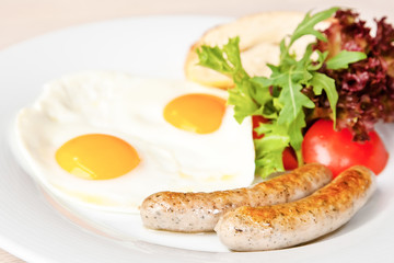 Fried eggs with sausages
