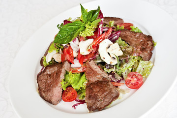 Mix salad with veal