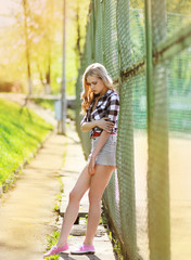 Street fashion young girl posing in summer urban style