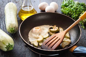 fried eggs with zucchini and parsley