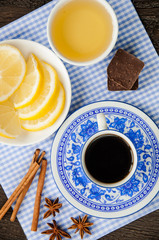 espresso in blue cup with lemon and honey on table