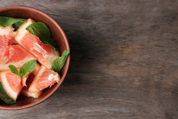 Ripe chopped grapefruit with mint leaves