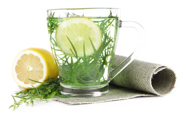 Glass of estragon drink on napkin isolated on white