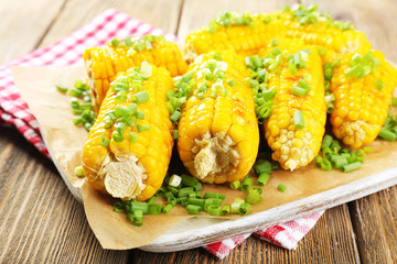 Grilled corn cobs on table, close-up