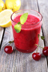 Fresh cold cherry cocktail with mint and lemon