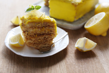 Tasty lemon dessert on wooden table
