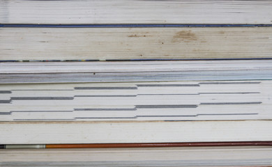 Old books on a wooden shelf. No labels, blank spine.