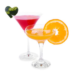 Watermelon and orange cocktails in glasses isolated on white