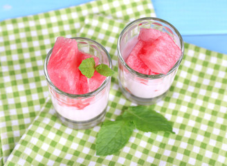 Watermelon cocktail in glasses on wooden table close-up