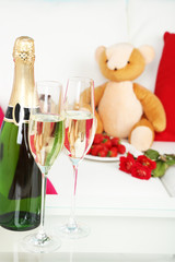 Romantic still life with champagne, strawberry and roses in