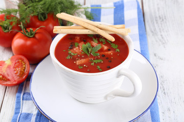Tasty tomato soup with croutons on table close-up