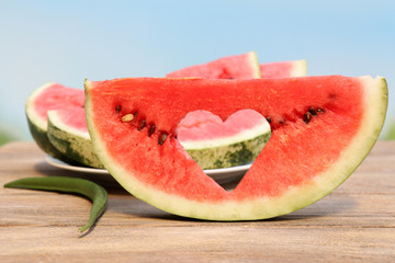 Fresh slice of watermelon on table outdoors, close up